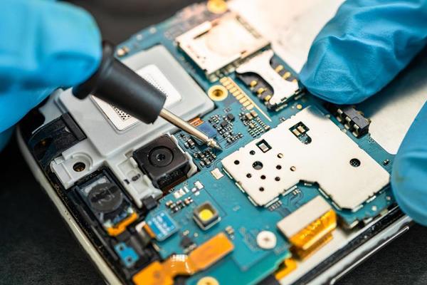 technician-repairing-inside-of-mobile-phone-